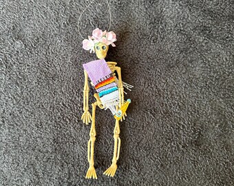 Lavander Sarape day of the dead skeleton ornament with a flower crown and soda