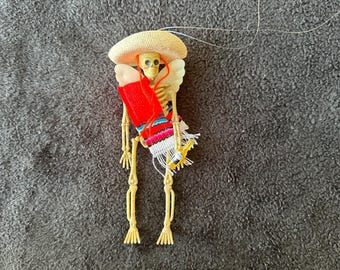 Red Sarape day of the dead skeleton ornament with wings and a beer #03