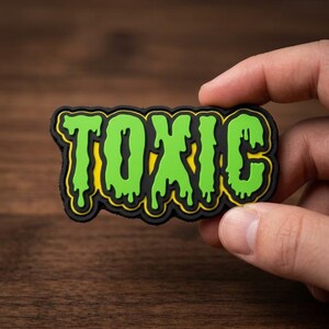TOXIC PVC Morale Patch - Neon Green Dripping Lettering Tactical Badge for Backpack, Vest, Jacket, Hat, and Everyday Carry Gear