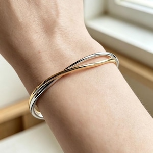 Verschlungenes zweifarbiges offenes Armband