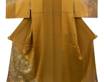 May include: A golden-yellow kimono with a striped pattern. The sleeves and hem feature floral embroidery in white, gold, and brown. The garment has a traditional Japanese design with wide sleeves and a wrap-around style.