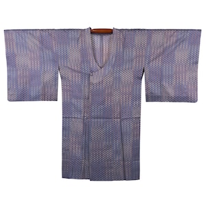May include: A light blue kimono with a woven checkered pattern. The kimono has wide sleeves and a V-neck collar. The garment is displayed on a wooden hanger against a white background.