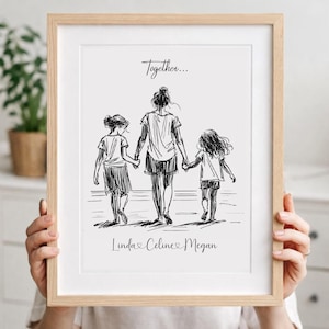 May include: A framed black and white sketch print. The artwork depicts a mother and two children walking hand-in-hand. The text "Together..." is above the figures, and the names "Linda, Celine, Megan" are below.
