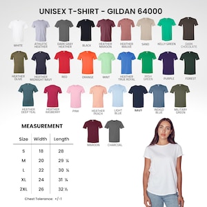 May include: A Gildan 64000 unisex t-shirt colour chart displaying thirty-one solid and heathered colour options with labels. A measurement table lists sizes S through 2XL with width and length in inches. A white t-shirt is shown on a person.