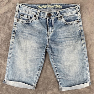 May include: A rustic wooden sign with the text "Welcome to our home" in white lettering. The sign features a distressed finish and a simple, inviting design, perfect for a front porch or entryway.