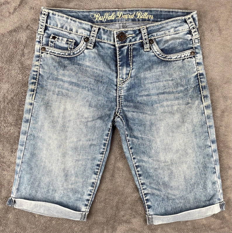 May include: A rustic wooden sign with the text "Welcome to our home" in white lettering. The sign features a distressed finish and a simple, inviting design, perfect for a front porch or entryway.