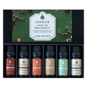 Peut inclure: Un coffret cadeau de Noël avec six flacons d'huiles essentielles de 10 ml. Les flacons sont présentés dans une boîte noire avec des décorations festives. Chaque flacon porte l'étiquette de la marque "IGNILUX" et un nom de parfum différent.
