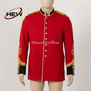 May include: A bright red military-style tunic featuring a high collar, gold braided shoulder epaulets, and gold buttons down the front. The sleeves have black cuffs with intricate gold embroidery. The text HEW and HistoricEraWear are visible.