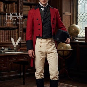 Puede incluir: Una taza de cerámica blanca con un asa negra y el texto "But First, Coffee" en negro, con una fuente de estilo manuscrito. La taza está sobre una superficie blanca.