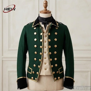 May include: A dark green military-style jacket featuring a double-breasted front with two columns of gold-toned buttons, a black collar, black cuffs, and gold piping trim. The jacket is worn over a cream-colored vest with a central row of buttons.