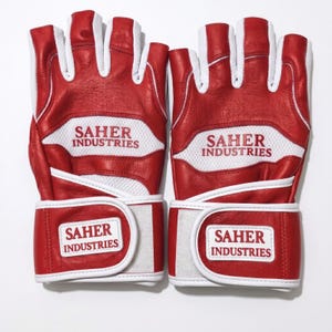 May include: A pair of red and white fingerless gloves featuring white mesh panels and red leather sections. The text SAHER INDUSTRIES is printed in red on the white mesh and on a white rectangular patch on the adjustable wrist strap of each glove.