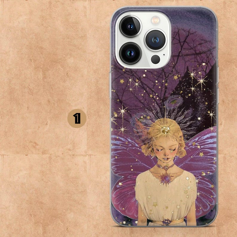 May include: A phone case featuring a fairy illustration. The design showcases a fairy with purple wings, a white dress, and a golden crown, set against a purple background with stars and a full moon. The case is made of a clear, protective material.
