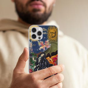 May include: A phone case featuring a celestial design with a sun, moon, stars, and a woman with long black hair. The artwork has a vintage aesthetic with a dark blue background and colorful accents. The case has a clear border.