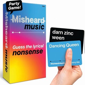 May include: A party game box with a gradient background of pink, blue, and yellow. The box reads "Misheard Music" and "Guess the lyrical nonsense." Two cards are displayed, one black with "darn zinc ween" and a blue card with "Dancing Queen."