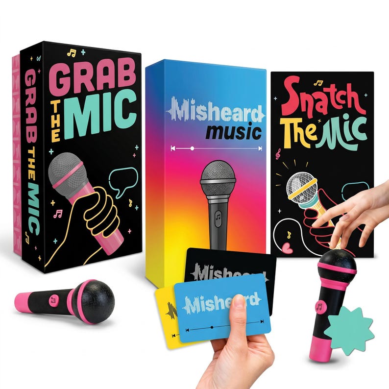 May include: A game set with three boxes and a toy microphone. The boxes feature the phrases "Grab the Mic", "Misheard music", and "Snatch the Mic". The toy microphone is black and pink. Several game cards are also visible.