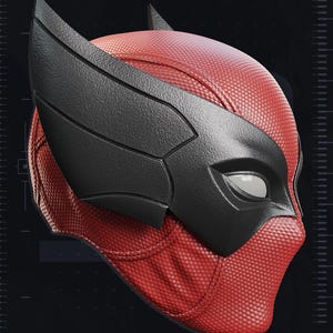 May include: A red and black superhero mask with a textured surface. The mask features a black eye covering and wing-like accents. The image includes the text "2020" and "YOSH STUDIOS".