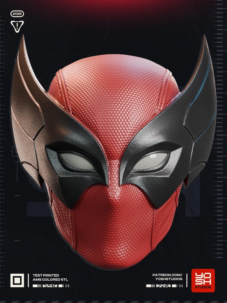 May include: A red and black mask with a textured surface, featuring large, stylized black wings on the sides. The mask has white eye openings and a distinctive design. The text "TEST PRINTED AMS COLORED STL" is visible.