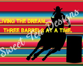 May include: A silhouette of a cowgirl riding a horse around three barrels on a colorful striped background. The text "Living the Dream... Three Barrels at a Time" is written in yellow on the background.
