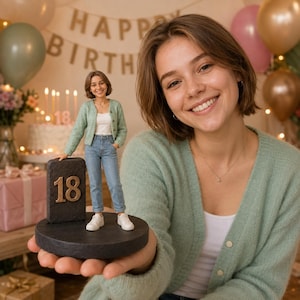 May include: A custom figurine depicting a person with short brown hair wearing a light green cardigan, white top, blue jeans, and white sneakers. The figure stands on a circular black base next to a rectangular black plaque featuring the gold number 18.