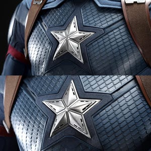May include: Close-up of a Captain America costume chest piece. The blue and silver design features a large, five-pointed star emblem on the chest. The costume has a textured, scale-like pattern and brown straps.