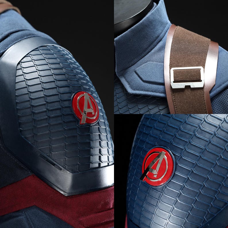 May include: Close-up of a blue and red costume with a textured pattern. The costume features a red and silver Avengers logo on the shoulder and chest. A brown strap with a silver buckle is visible.
