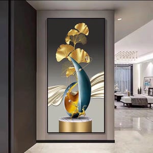 May include: Abstract wall art featuring a gold and teal sculpture with gold leaf accents. The artwork includes a gold base and a deer figurine. The background is a gradient of grey and white with gold wave-like details. The piece is framed in black.