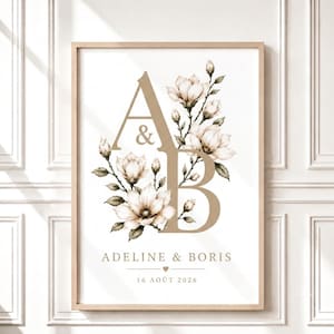 Peut inclure: Une affiche murale rectangulaire verticale présentant les grandes lettres beiges A et B entrelacées d'illustrations détaillées de fleurs de magnolia blanches et de feuilles vertes. Le texte ADELINE & BORIS et 16 AOÛT 2026 figure en dessous.