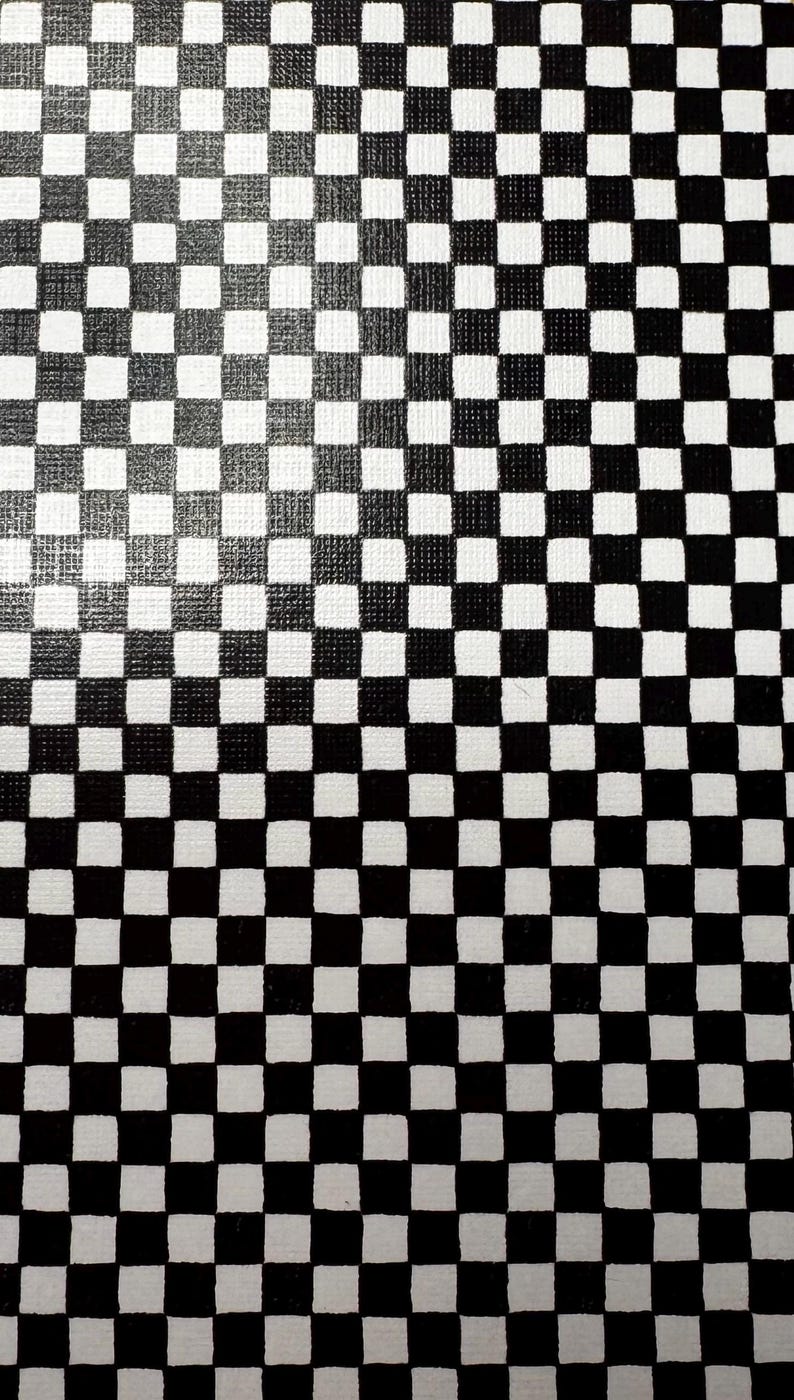 May include: A canvas surface featuring a repeating black and white checkerboard pattern. The grid consists of uniform square tiles arranged in a consistent layout across the entire visible area, creating a high-contrast geometric design.