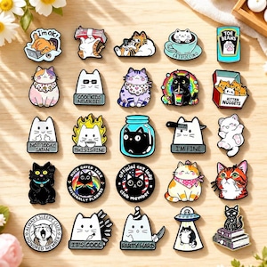 May include: A collection of twenty-five colourful enamel pins featuring various cat illustrations. The designs include cats with text like I'm ok, Cool kids never die, Not today Satan, This is fine, I'm fine, Official cat lady, and Always sleepy club.