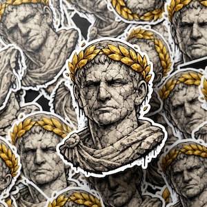 May include: A sticker sheet featuring a repeating pattern of a bust of a Roman emperor. The bust is depicted in a cracked, stone-like texture, wearing a golden laurel wreath. The image has a distressed, aged appearance.