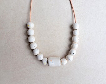 White porcelain handmade necklace, white glaze with colorful dots