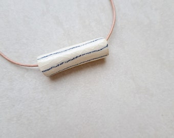 Porcelain necklace, white porcelain with blue lines, underglaze pencil, handmade drawing on porcelain