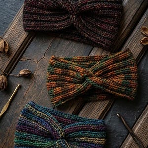 May include: A white ceramic mug with a black handle and the text "But First, Coffee" in a bold, black font. The mug sits on a white surface, showcasing its clean design.