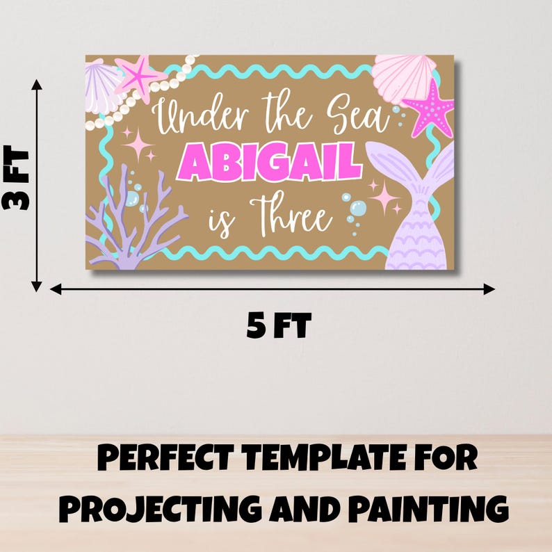 May include: A rectangular banner measuring 3 feet by 5 feet with a tan background. It features the text "Under the Sea ABIGAIL is Three" in white and pink. The design includes illustrations of pink starfish, seashells, a mermaid tail, and coral.