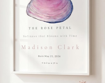 May include: A framed white wall art print featuring a watercolor illustration of a pink and blue seashell. The text reads: THE ROSE PETAL, Softness that Blooms with Time, Madison Clark, Born May 21, 2026, 9 lb 2 oz, 19 in. The frame is white.