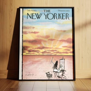 May include: A framed magazine cover of The New Yorker dated July 16, 1973. The top half features a sunset with pink and orange clouds. The bottom half shows a line drawing of an artist painting at an easel in a vast, empty landscape.
