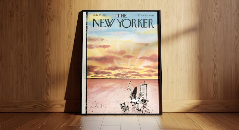 May include: A framed magazine cover of The New Yorker dated July 16, 1973. The top half features a sunset with pink and orange clouds. The bottom half shows a line drawing of an artist painting at an easel in a vast, empty landscape.