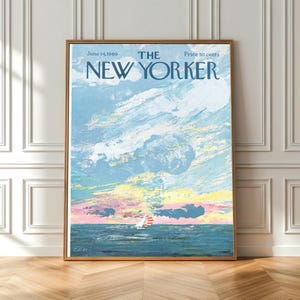 May include: A framed print of a vintage New Yorker magazine cover. The artwork depicts a sailboat on the ocean under a cloudy sky with pastel colors. The text reads "The New Yorker" and the date "June 14, 1969."