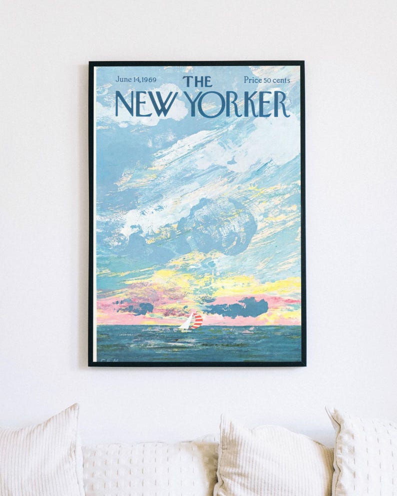 May include: Framed vintage New Yorker magazine cover from June 14, 1969, featuring a seascape with a sailboat under a colorful sky. The artwork is in shades of blue, pink, yellow, and white, with the magazine title at the top.
