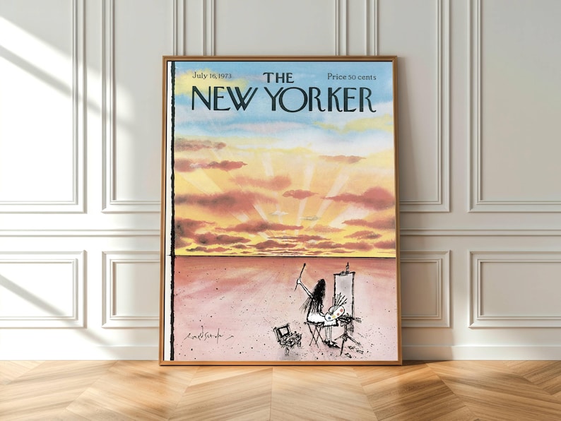 May include: A framed print of The New Yorker magazine cover dated July 16, 1973. The illustration depicts a person painting at an easel in a vast, flat landscape under a sunset sky with pink, orange, and yellow clouds. The text reads The New Yorker.