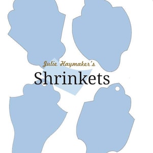 May include: Three light blue shrink plastic shapes with a hole at the top. The shapes are in the form of a seashell. The text "Julie Haymaker's Shrinkets" is printed in brown text below the shapes.