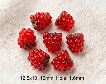 May include: Six translucent red raspberry-shaped beads with a textured surface. The beads measure 12.5x10~12mm with a 1.6mm hole. Each bead features a cluster of small rounded segments and a dark brown base detail.
