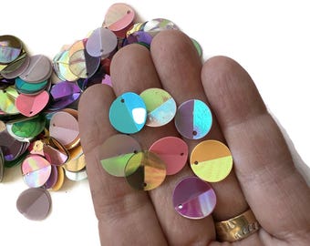 1 OZ ,  sequins,  round folded top hole, opaque, transparent, and iridescent colors. 12 mm