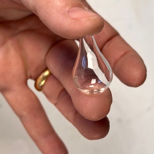 4,tear drop  clear blown glass bead with  top and bottom hol e