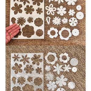 28, pre-cut shrink plastic flower shapes in sheets