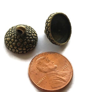 6- acorn  bead caps on aged bronze