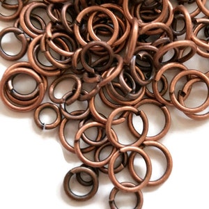 1/2 dry oz- copper jump rings  assorted size mix