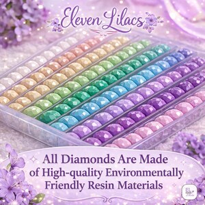 May include: A clear plastic storage tray containing rows of faceted, multi-colored resin diamonds in shades of white, beige, green, blue, and purple. The text Eleven Lilacs and All Diamonds Are Made of High-quality Environmentally Friendly Resin Materials is visible.