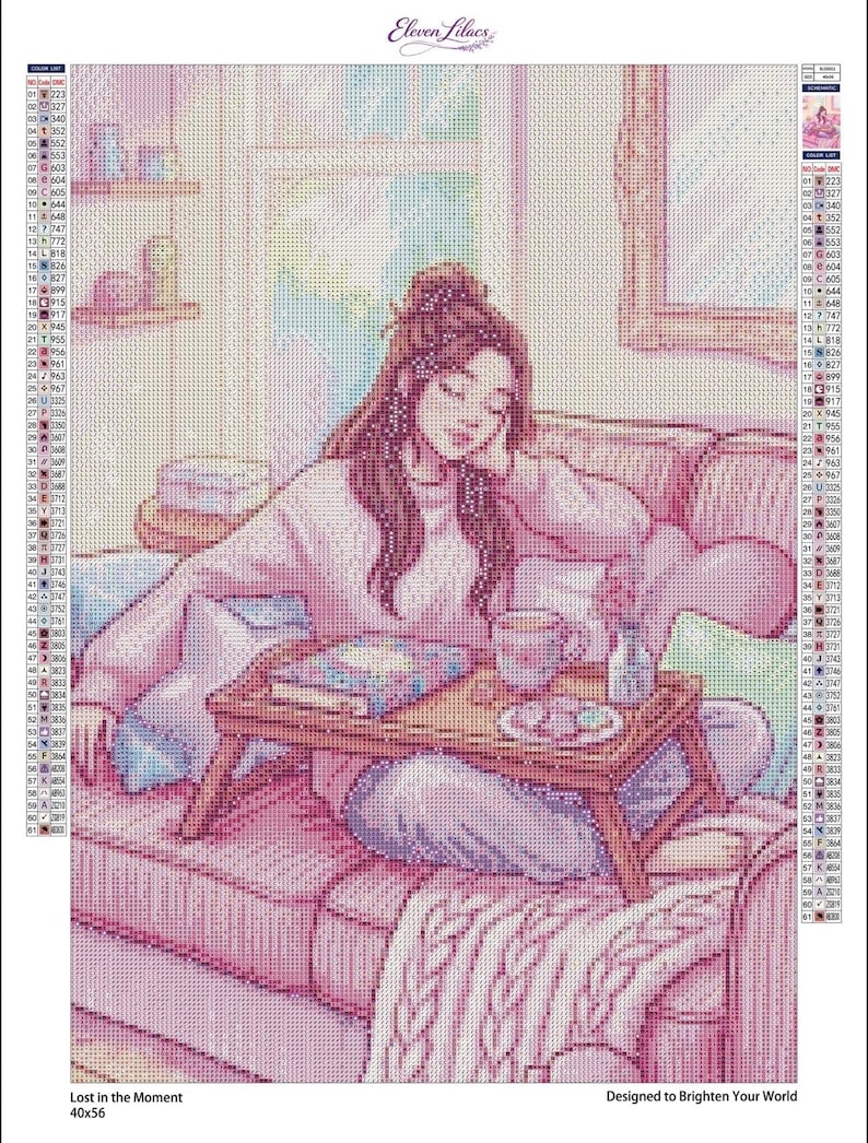 May include: A diamond painting kit titled Lost in the Moment featuring a person with brown hair sitting on a pink sofa with a wooden tray holding a book, a mug, and a small vase. The image includes a color legend, the text Eleven Lilacs, and 40x56.