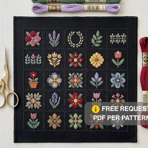 Può includere: Un pezzo di tessuto quadrato nero con una griglia di venticinque motivi floreali e botanici ricamati in vari colori. Forbici da ricamo dorate a sinistra e due matassine di filo da ricamo in alto e a destra.